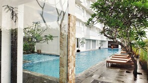 Outdoor pool, open 7:00 AM to 9:00 PM, pool umbrellas, sun loungers