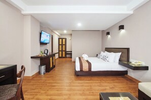 Junior Suite Pool View | Blackout drapes, iron/ironing board, free WiFi, bed sheets - Grand Santhi Hotel (Denpasar)