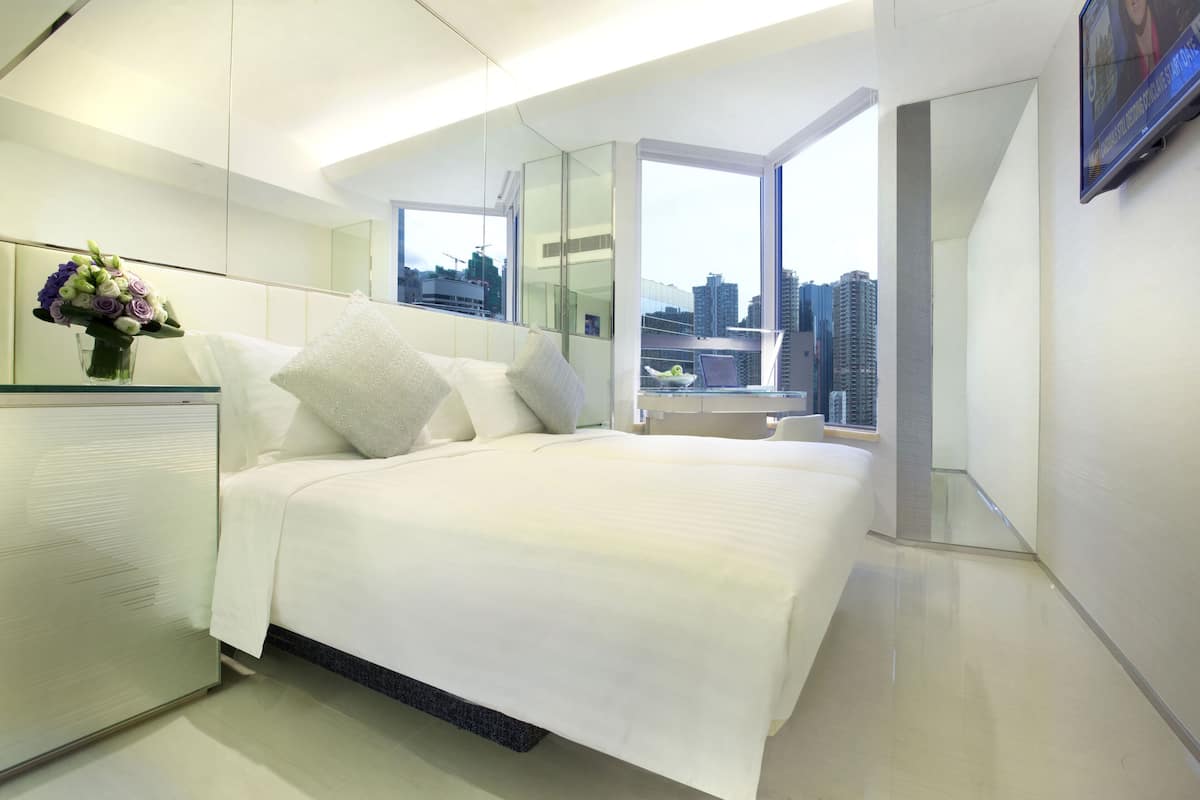 Camas con pillow-top, minibar y caja de seguridad en la habitación