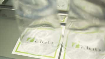 A close-up of a plastic bag with the word "club" printed on it, placed on a surface with a green border.