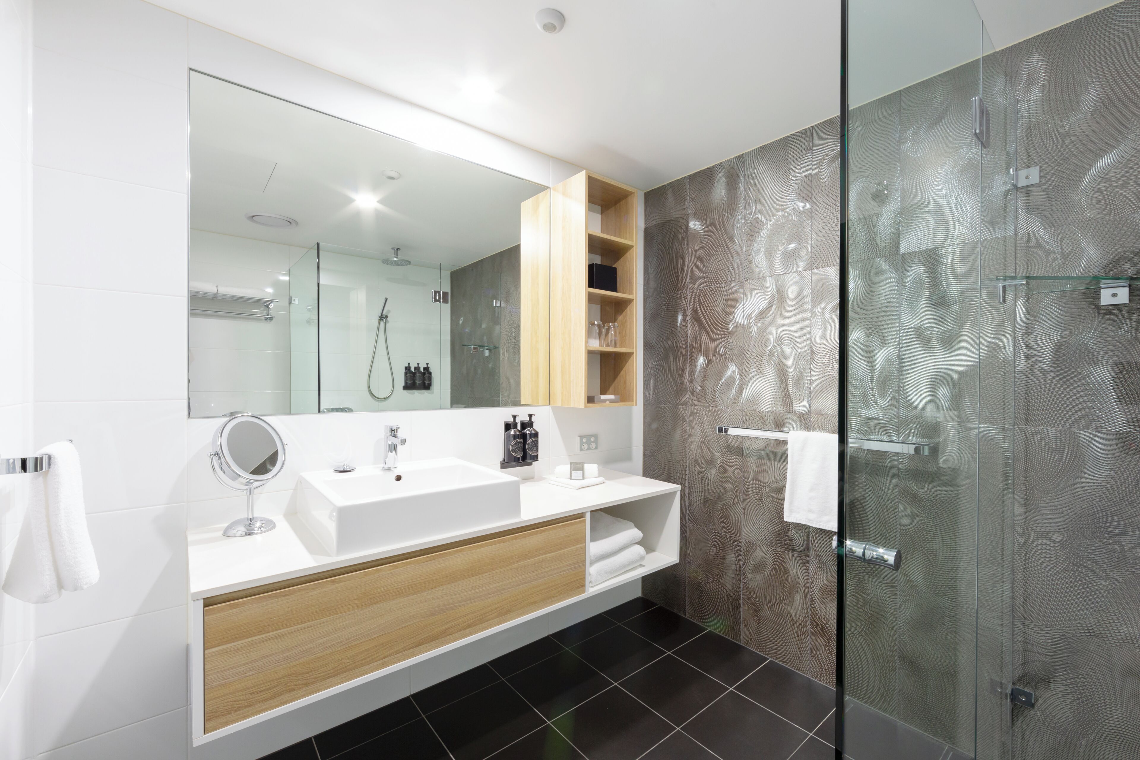 Shower, rainfall showerhead, designer toiletries, hair dryer