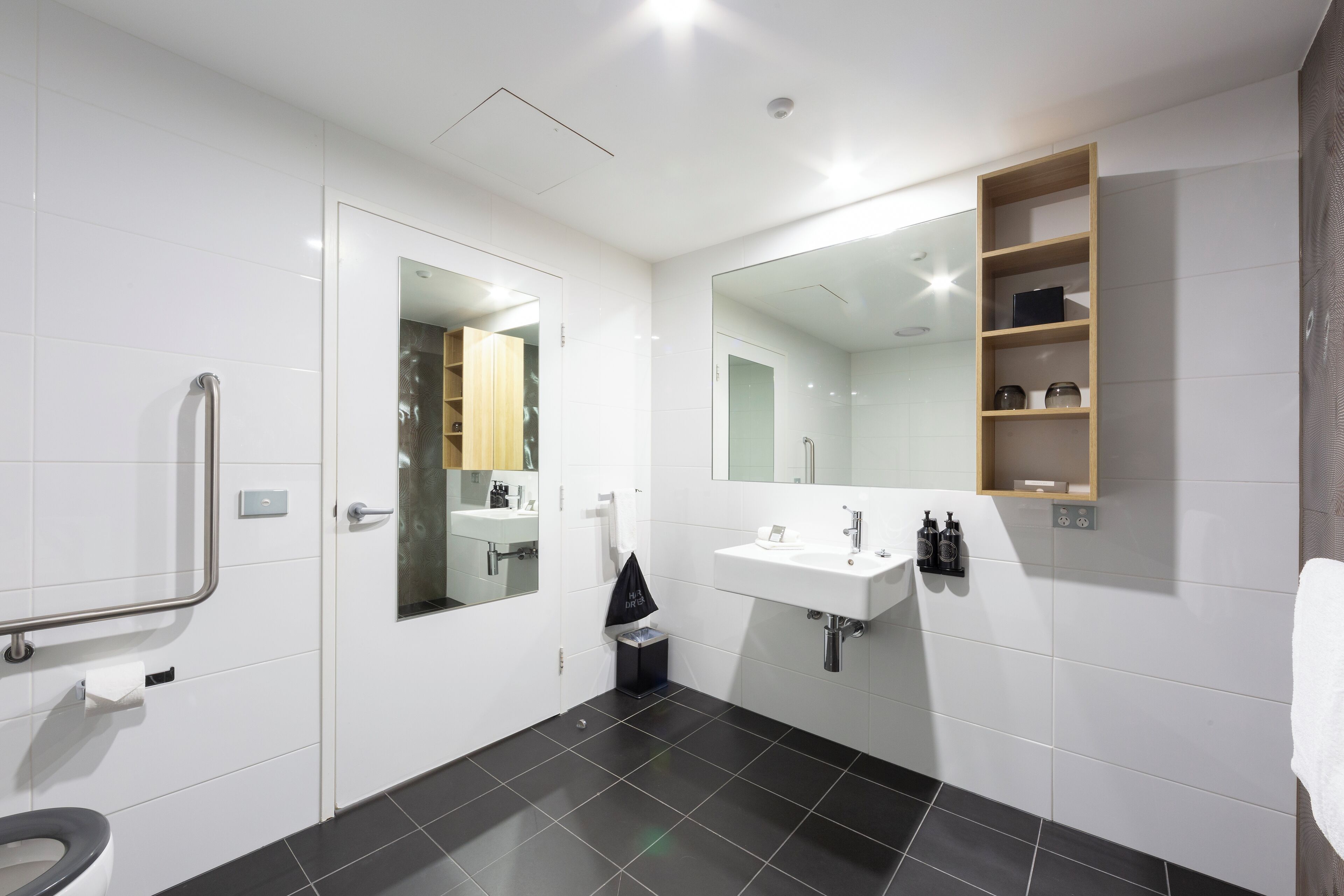 accessible one bedroom apartment | bathroom | shower, rainfall showerhead, designer toiletries, hair dryer