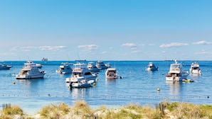 A marina with multiple boats docked. - Stay Rottnest (Rottnest Island)