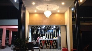 The entrance of a hotel with a prominent sign reading "CHITRA". - Chitra Villa (Pattaya)