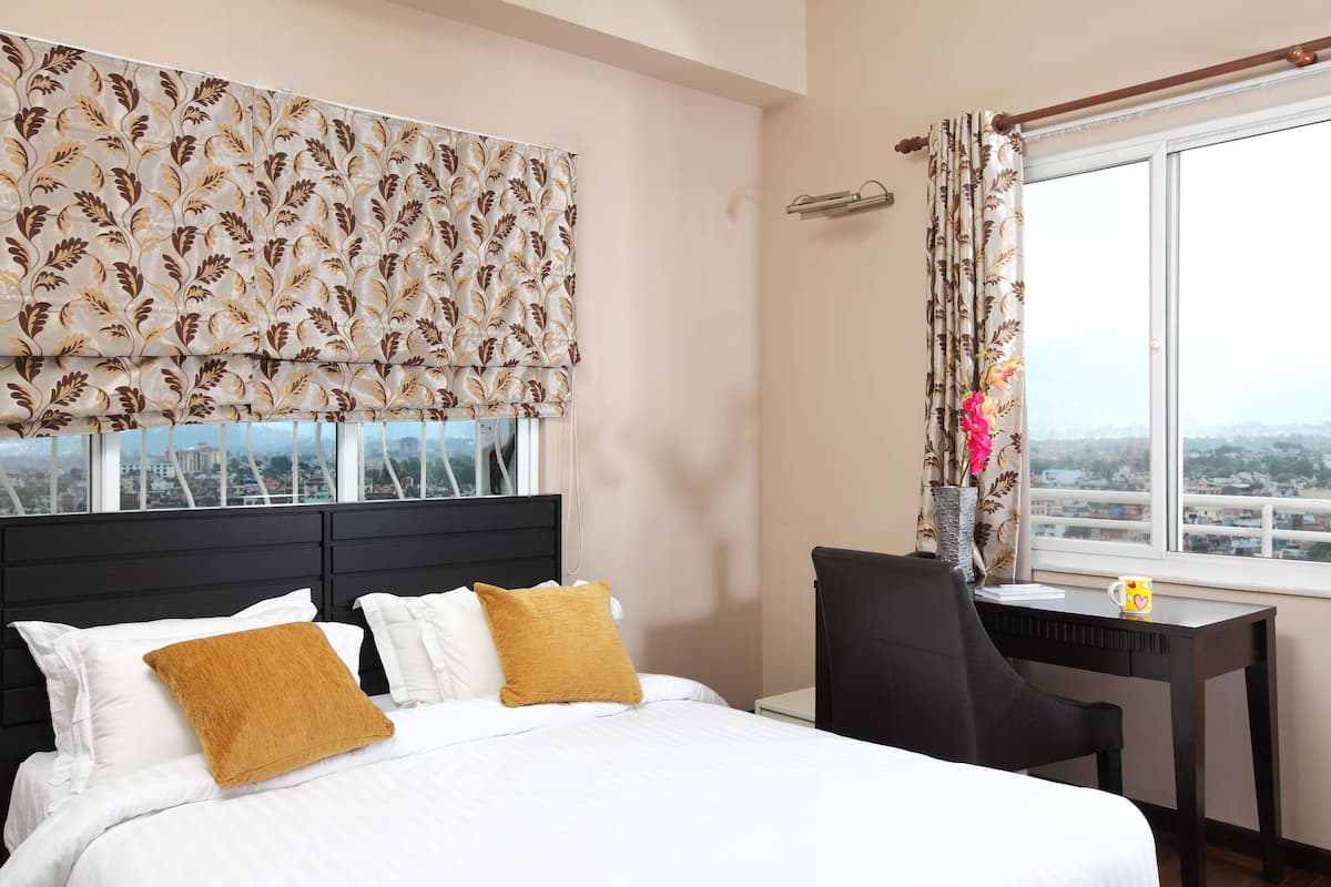 Standard Apartment, 2 Bedrooms, Kitchen, City View | In-room safe, individually decorated, iron/ironing board