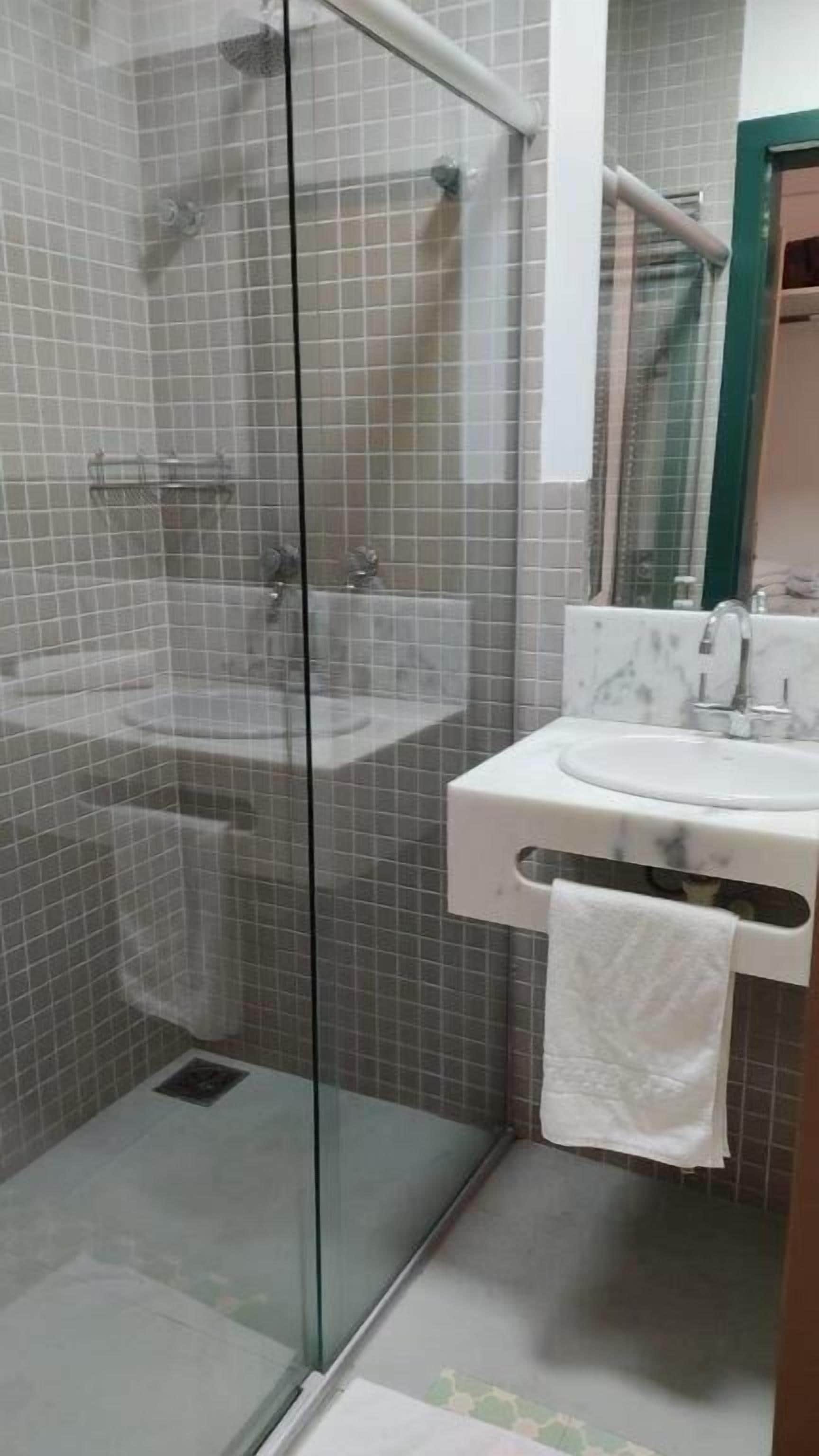 deluxe room | bathroom | shower, free toiletries, hair dryer, bathrobes