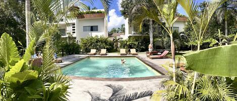 Outdoor pool, open 9:00 AM to 10:00 PM, pool loungers