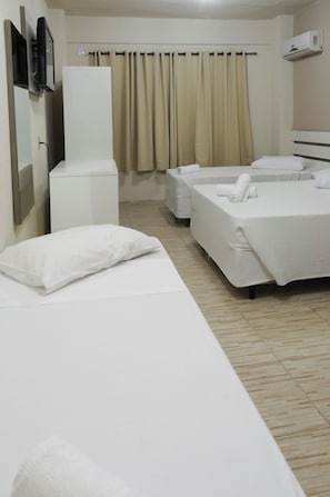 Deluxe Quadruple Room | Minibar, desk, blackout drapes, free WiFi