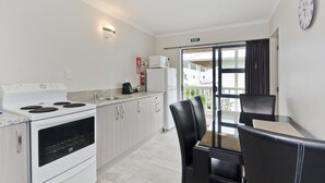 Two Storey 2 Bed Unit, 3 Beds M | Private kitchen | Coffee/tea maker, fridge, microwave, electric kettle - Matakana House Motel (Matakana)