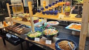 A buffet with various dishes and utensils. - Niseko Grand Hotel (Niseko)