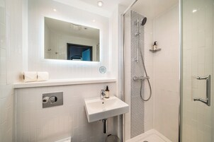 Shower, free toiletries, hair dryer, towels