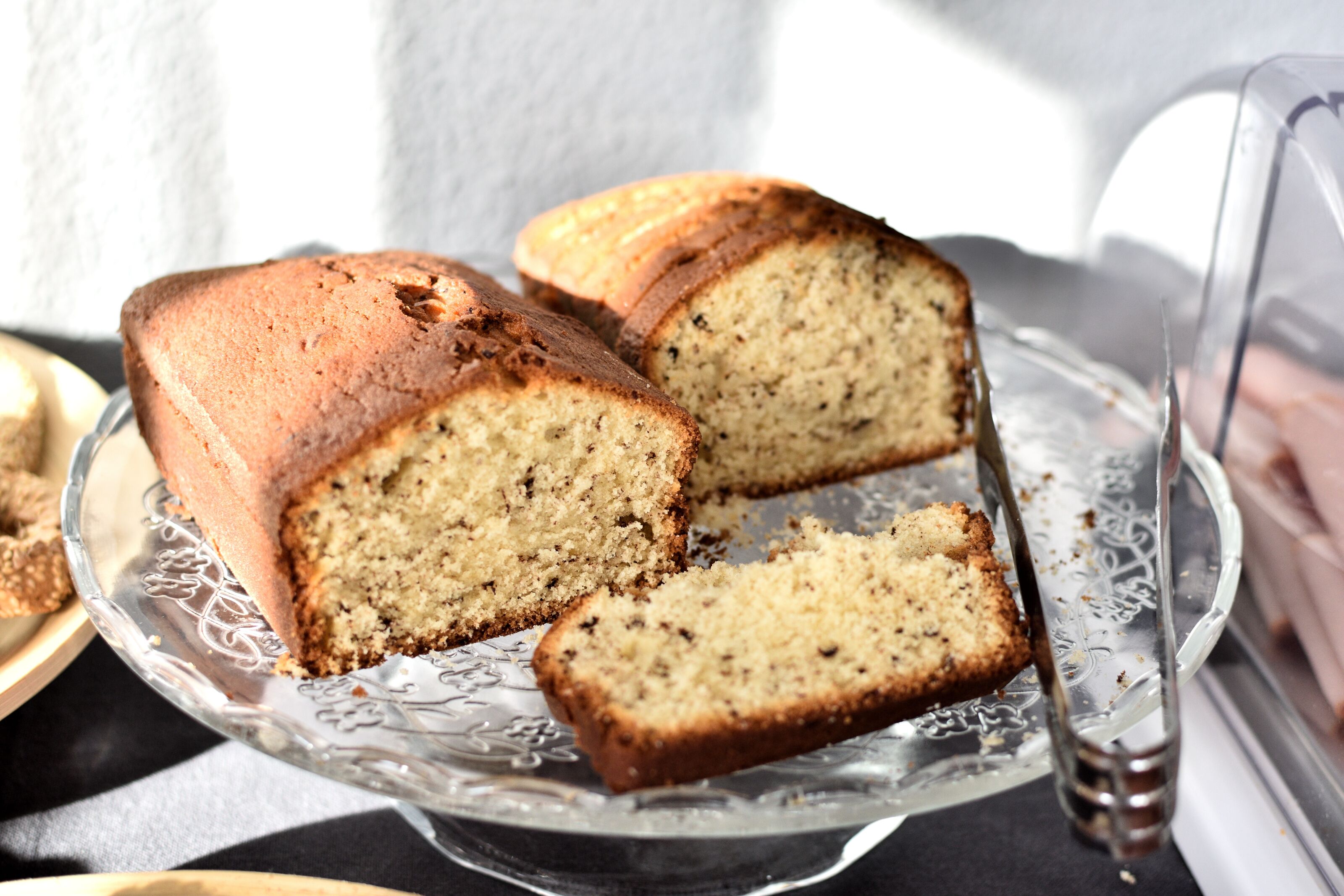 A loaf of bread on a glass plate.