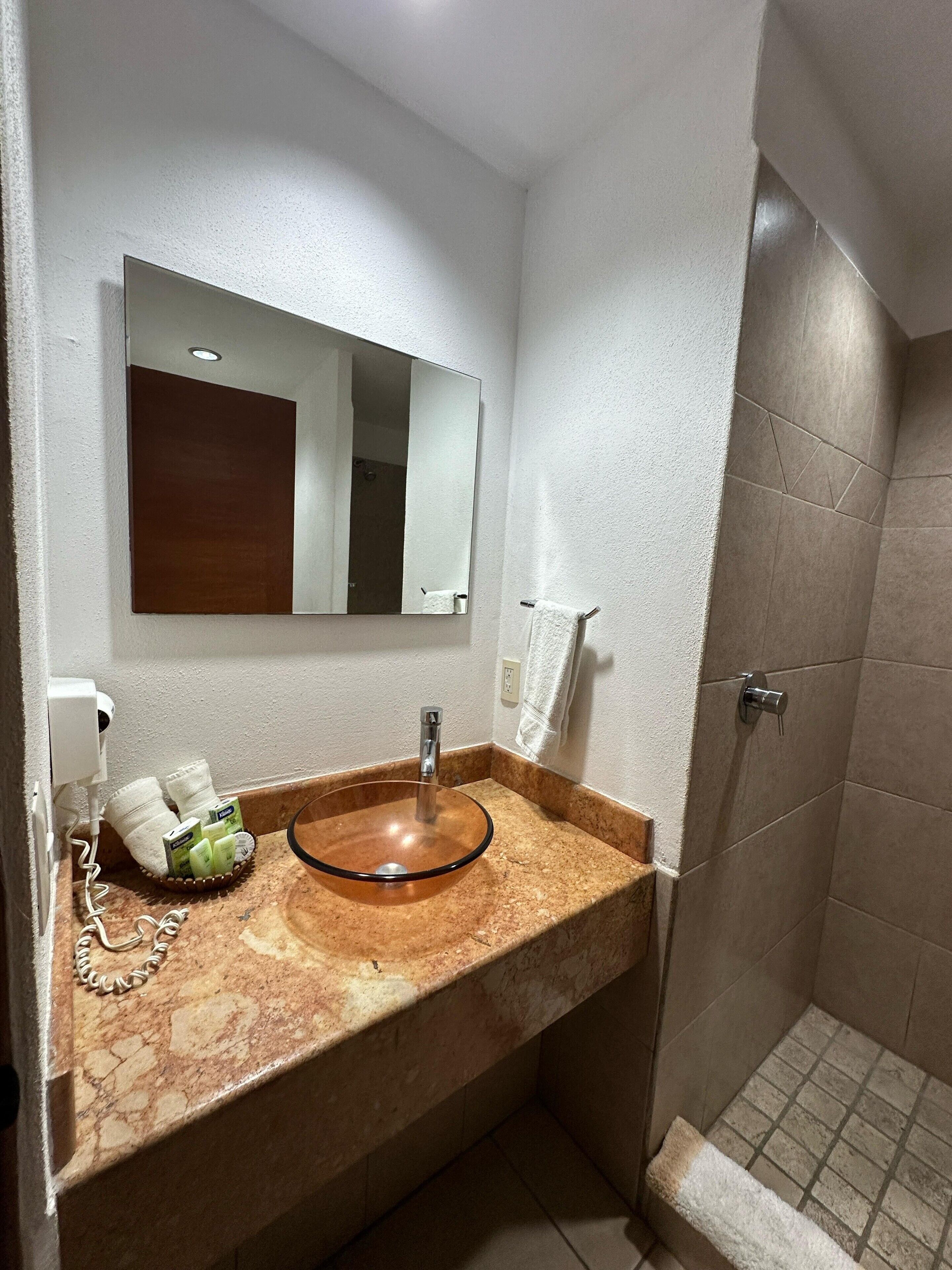 2bedroom suite with kitchen 102 | bathroom | shower, rainfall showerhead, hair dryer, towels