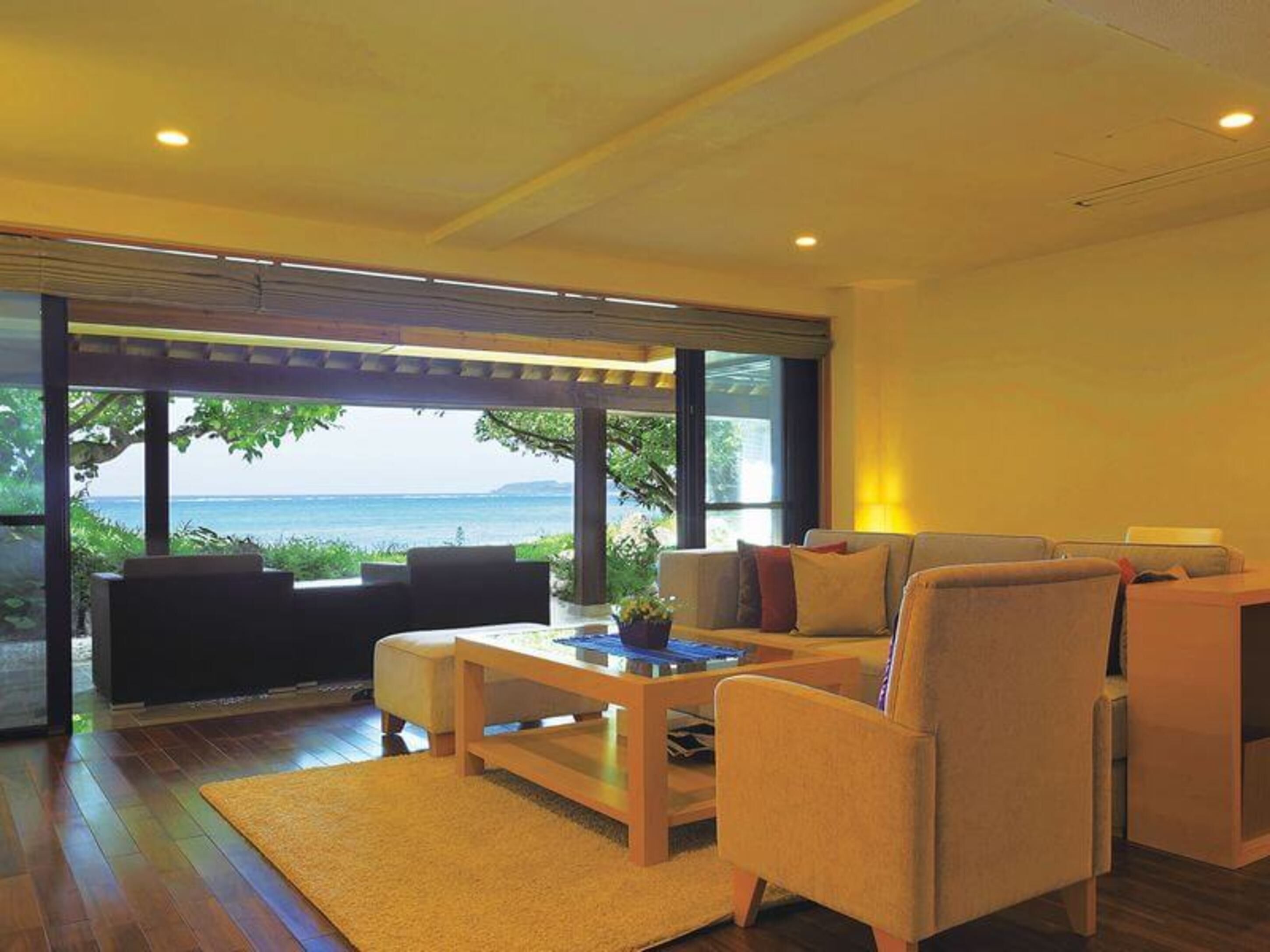 A modern living room with a large window overlooking a scenic view.