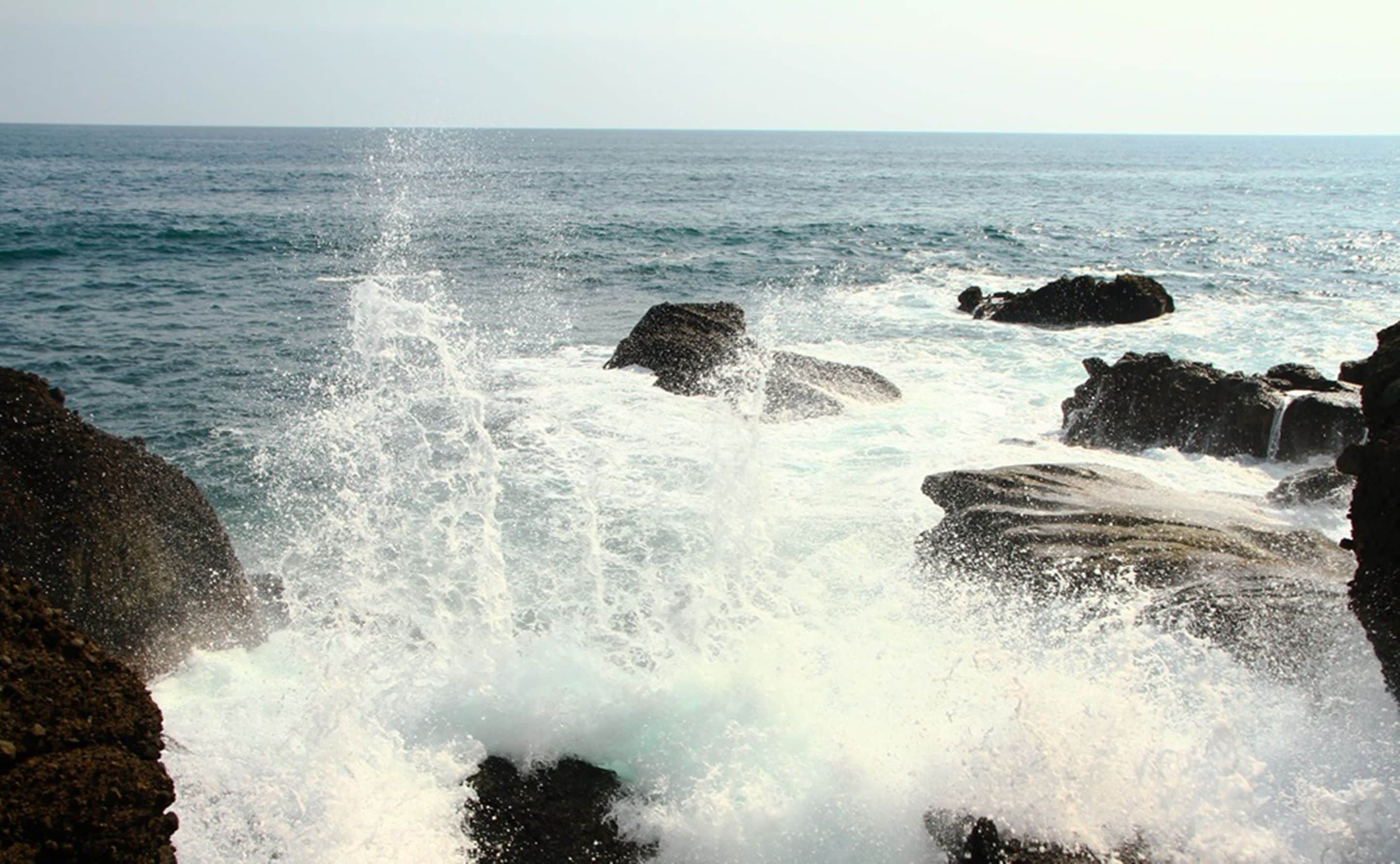 private beach, black sand, surfing