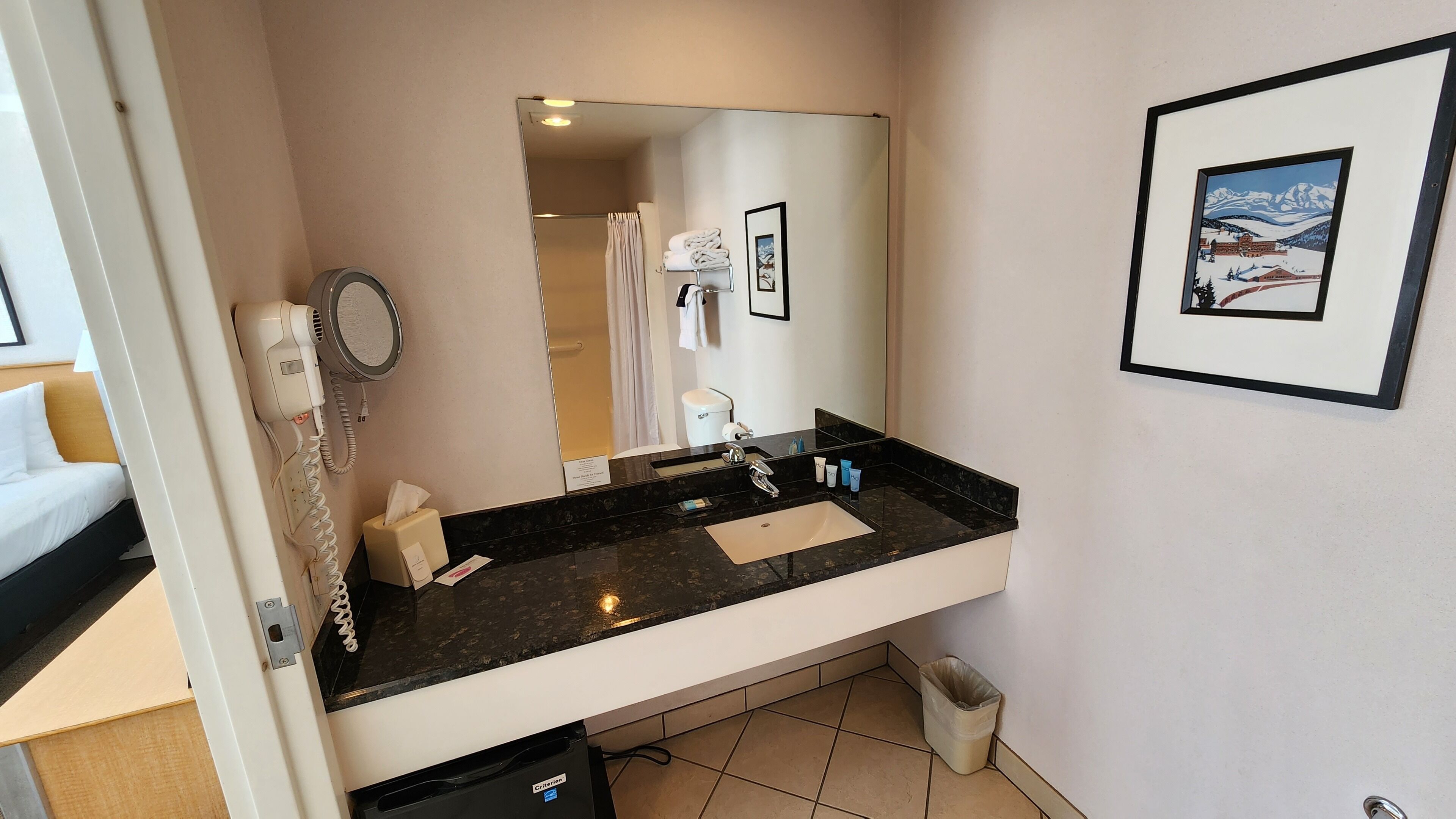 designer toiletries, hair dryer, towels, soap