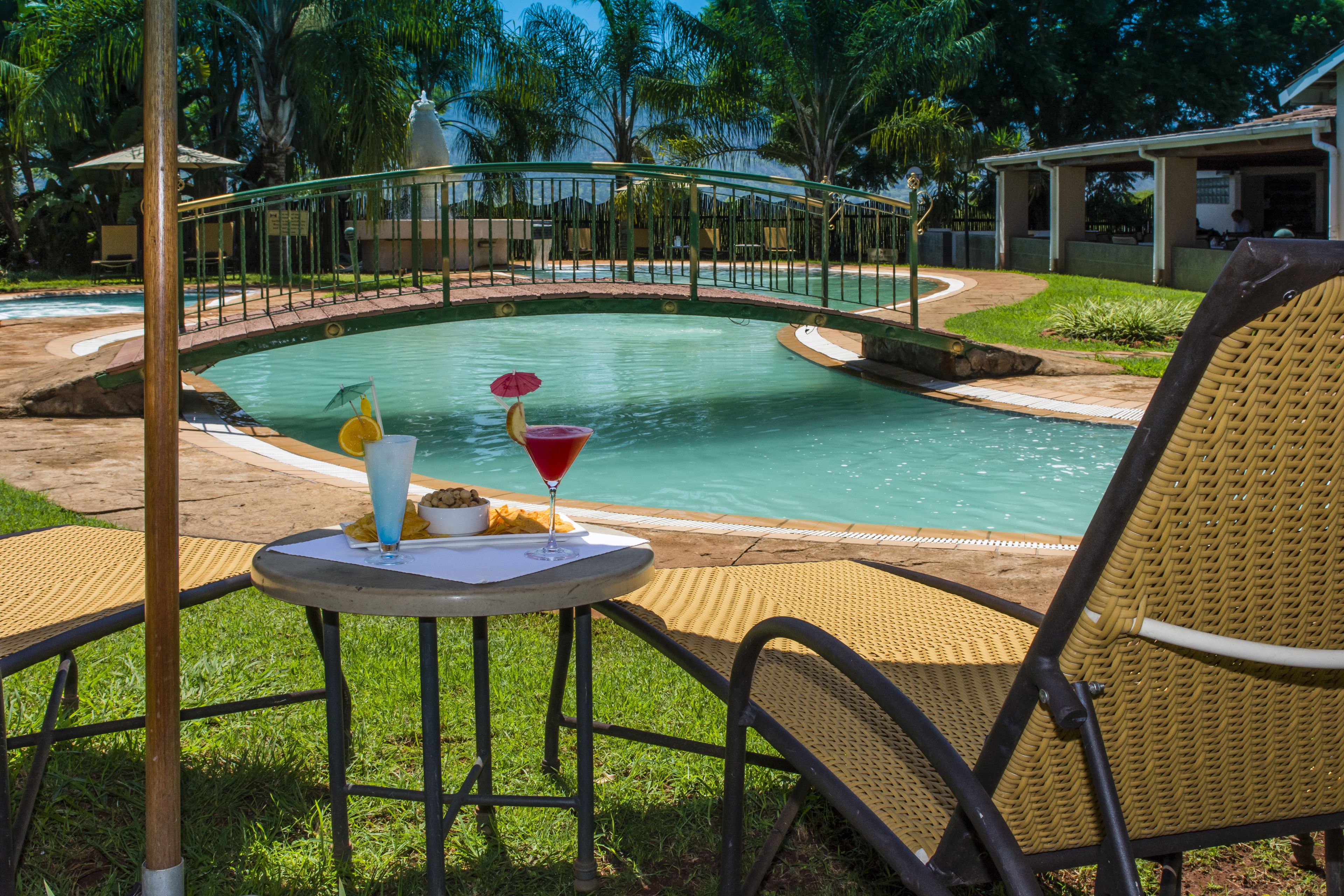 outdoor pool, pool umbrellas, pool loungers