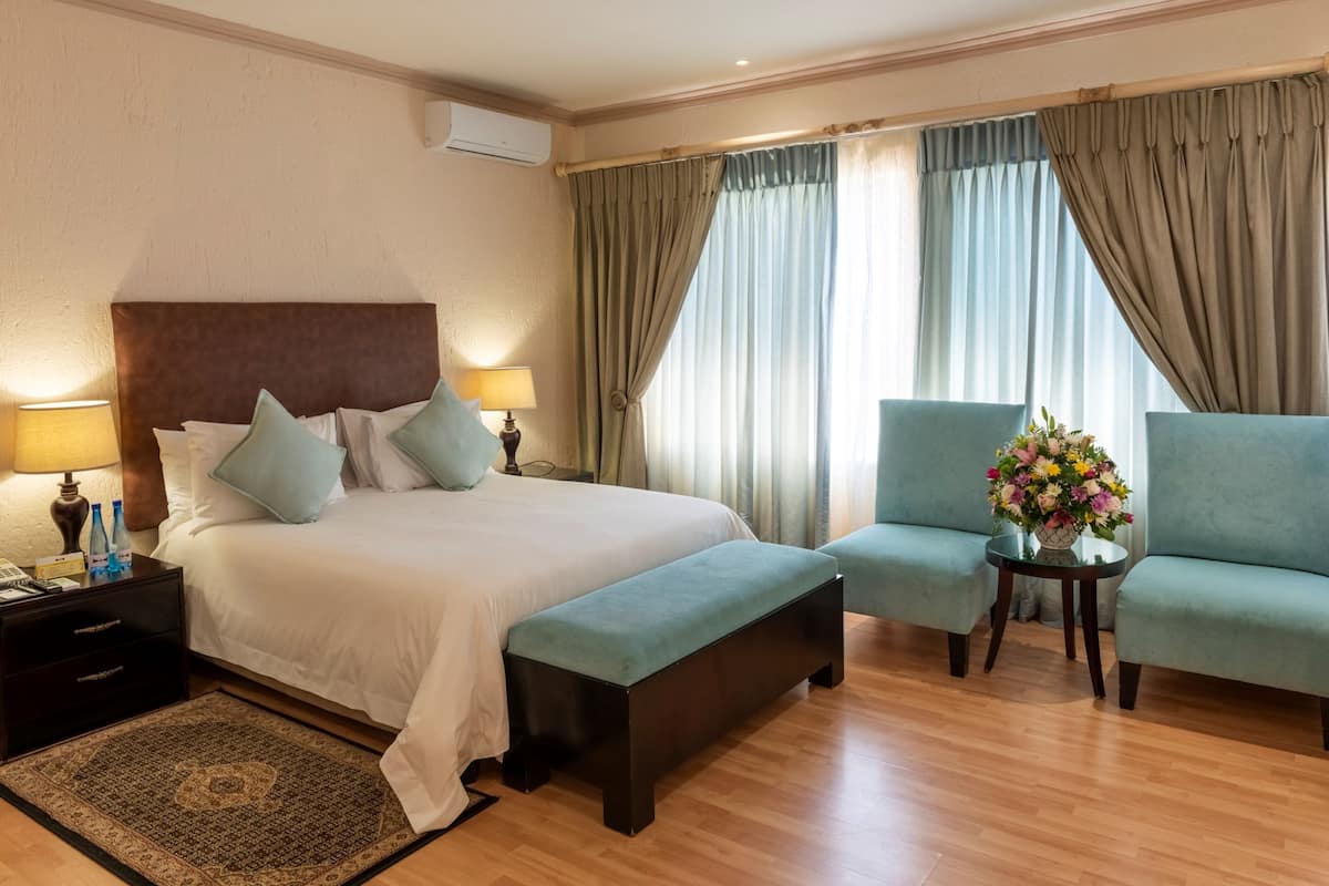 queen suite | premium bedding, tempur-pedic beds, blackout curtains, travel cot