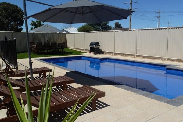 Outdoor pool, pool umbrellas, sun loungers