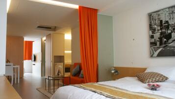 Habitación Deluxe con 2 camas individuales | Colchones Select Comfort, caja fuerte, tabla de planchar con plancha