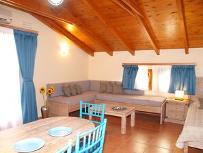 Penthouse With Partial Sea View | Living room | Flat-screen TV - Mylos Hotel Apartments  (Platanias)