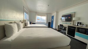 Deluxe Room, Multiple Beds | Desk, laptop workspace, blackout drapes, soundproofing