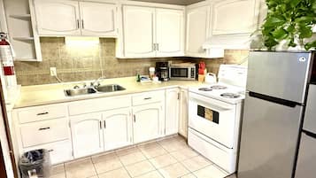 Grand Cottage | Private kitchen | Full-size fridge, microwave, coffee/tea maker