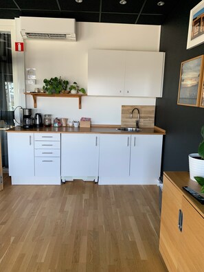 Family Quadruple Room | Private kitchen | Fridge, microwave, coffee/tea maker, electric kettle