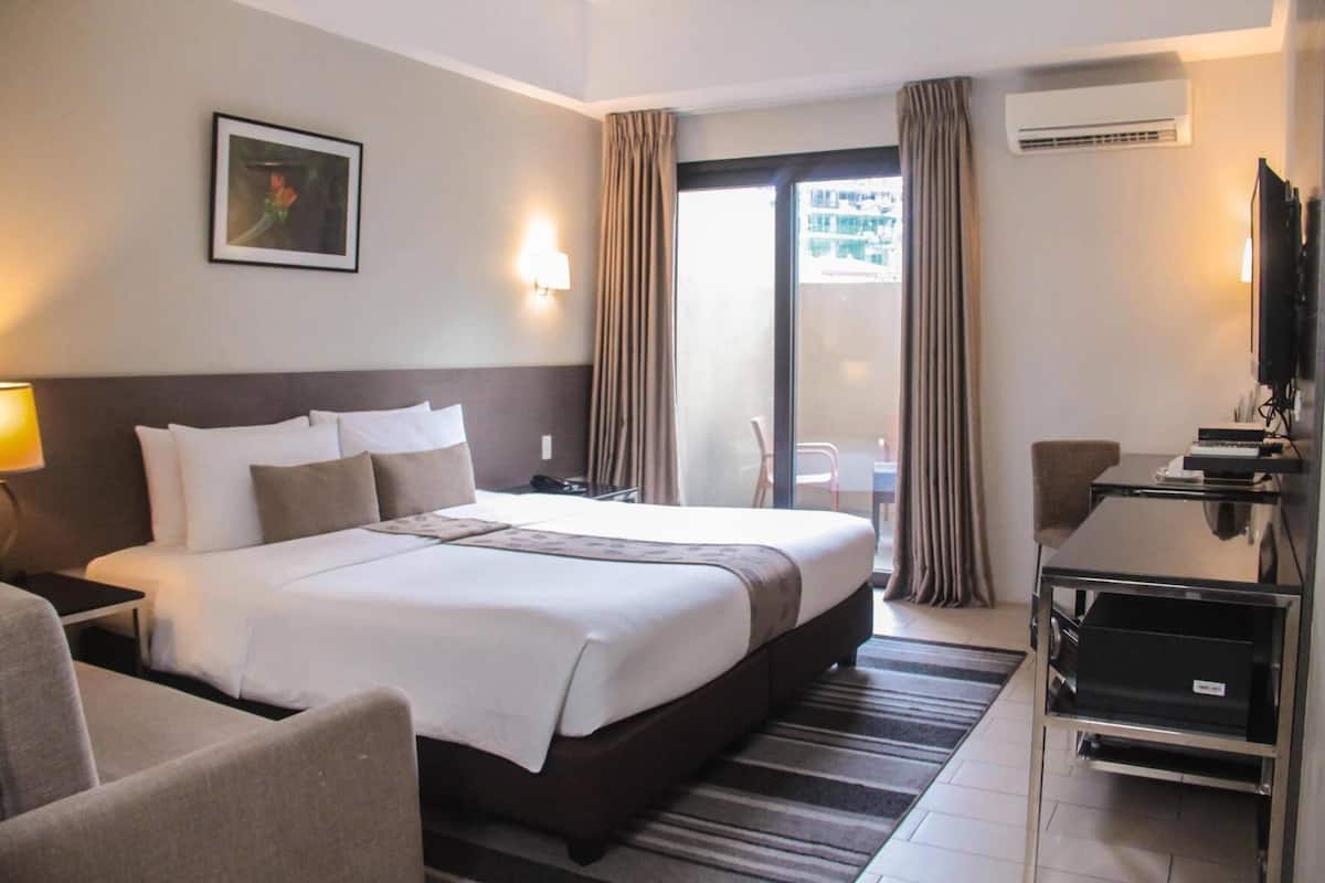 Minibar, desk, laptop workspace, blackout curtains