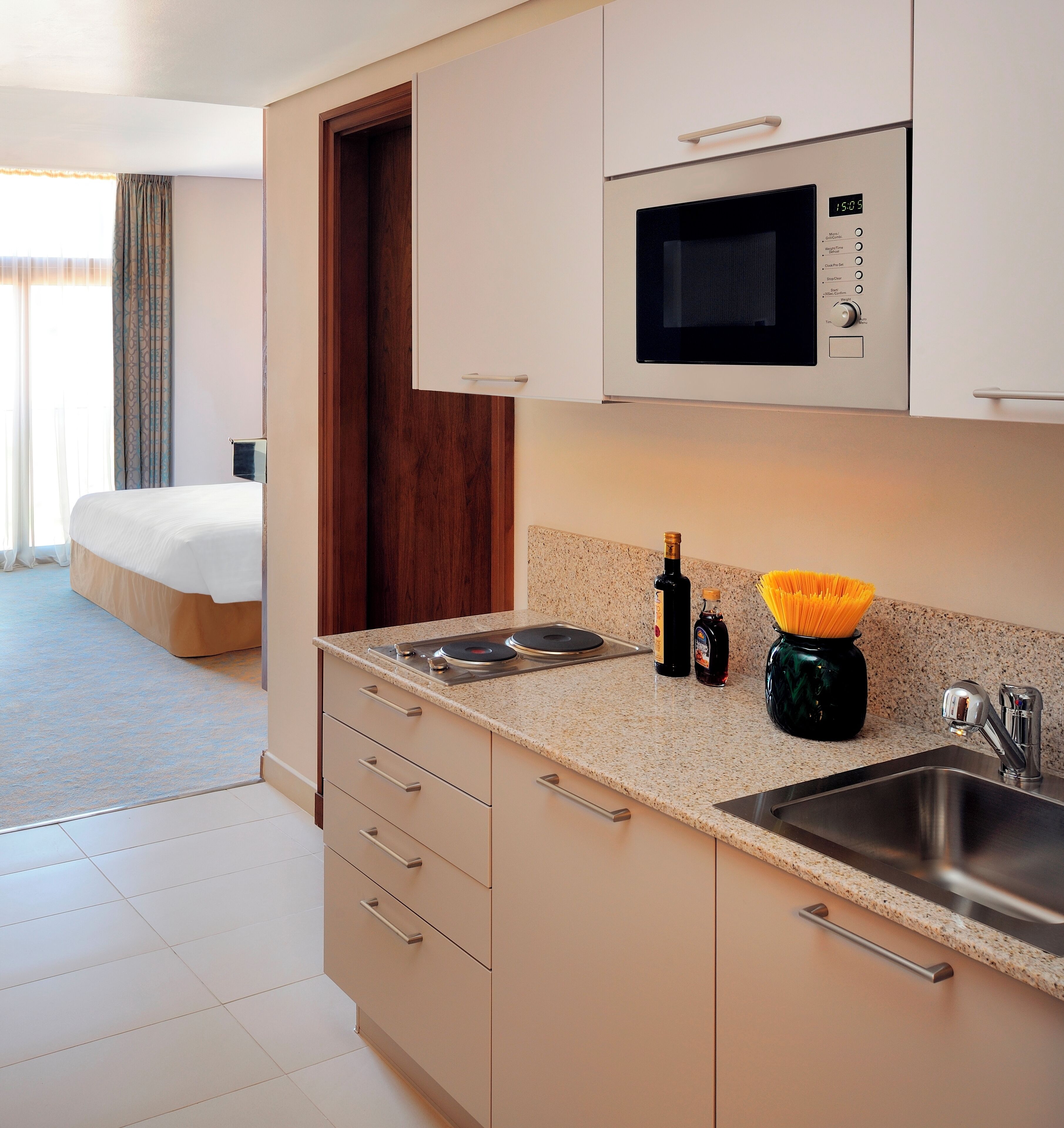 junior suite, 1 king bed, non smoking, sea view | private kitchen | fridge, microwave, stovetop, coffee/tea maker