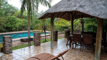 Family Room, Multiple Beds, Pool View | Terrace/patio