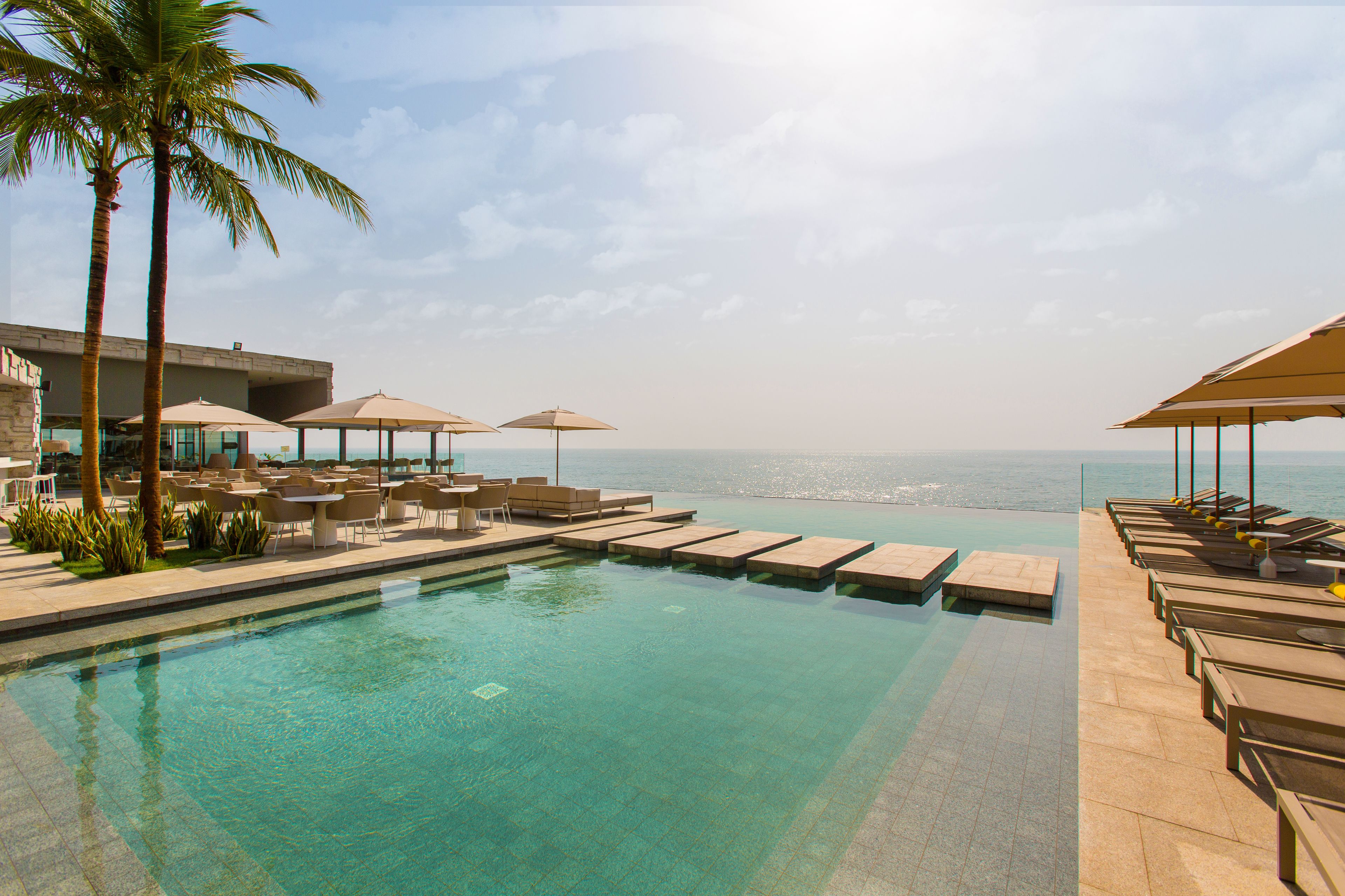 outdoor pool, pool umbrellas, pool loungers