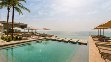 Outdoor pool, pool umbrellas, sun loungers