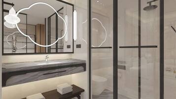 Un baño moderno con cabina de ducha de vidrio, lavamanos de mármol y espejo con luz integrada.