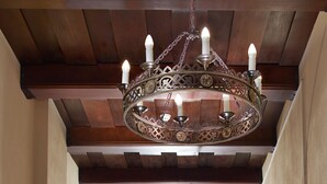 A hallway with a large ornate chandelier, wooden beams, and a door at the end. - Hotel Monastyrski Minsk City Centre (Minsk)