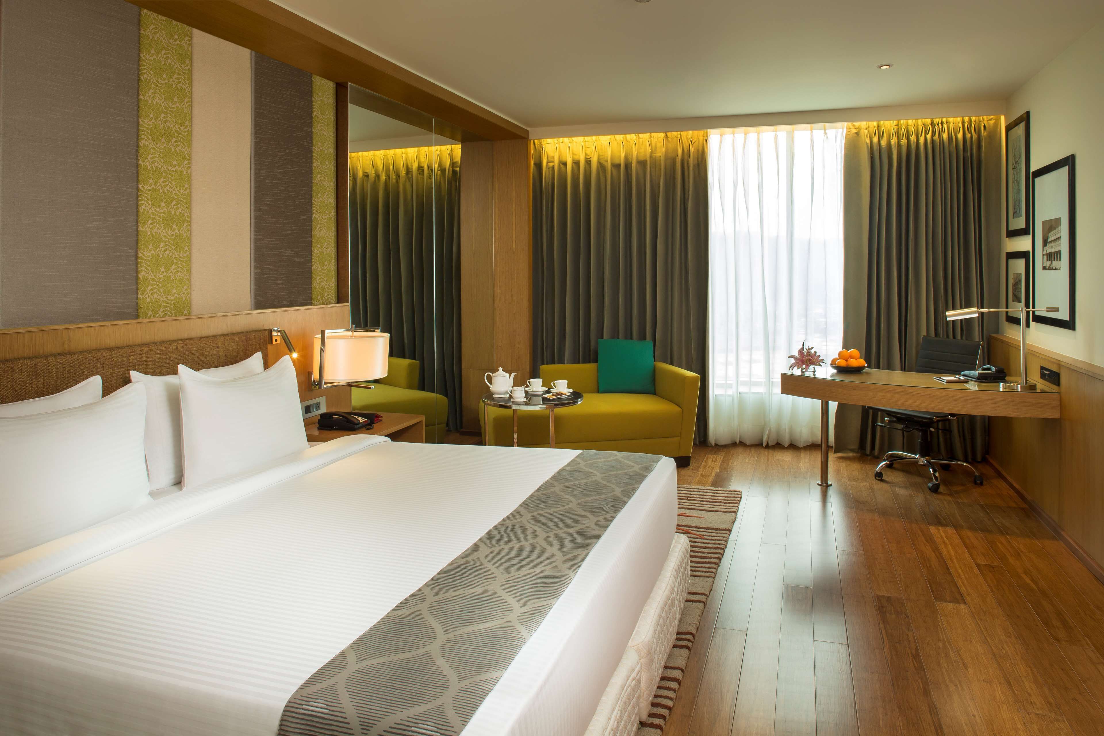 business room | 1 bedroom, premium bedding, minibar, in-room safe