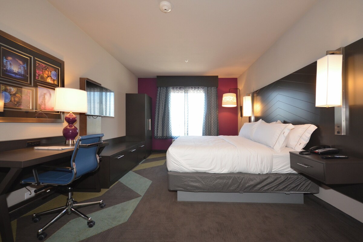 Premium bedding, desk, laptop workspace, soundproofing