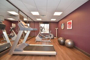 A gym with treadmills, elliptical machines, and exercise balls. - Holiday Inn Express & Suites Oklahoma City Mid - Arpt Area by IHG (Oklahoma City)