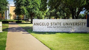 A sign for Angelo State University with a pathway leading to the entrance. - Candlewood Suites San Angelo TX by IHG (San Angelo)