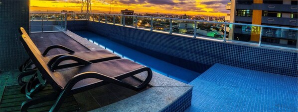 Outdoor pool, open 8:00 AM to 10:00 PM, pool umbrellas, sun loungers