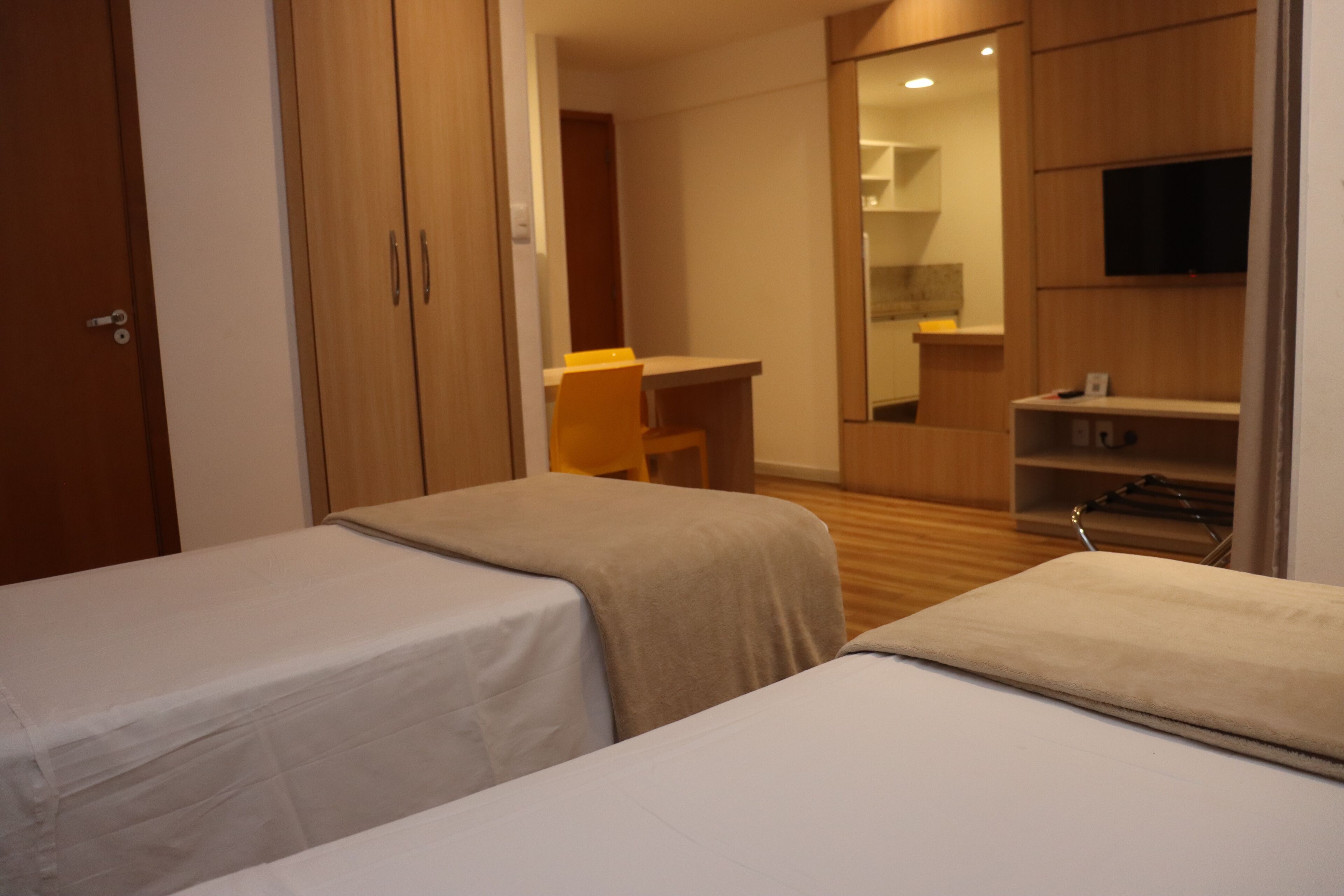 Desk, laptop workspace, blackout drapes, iron/ironing board