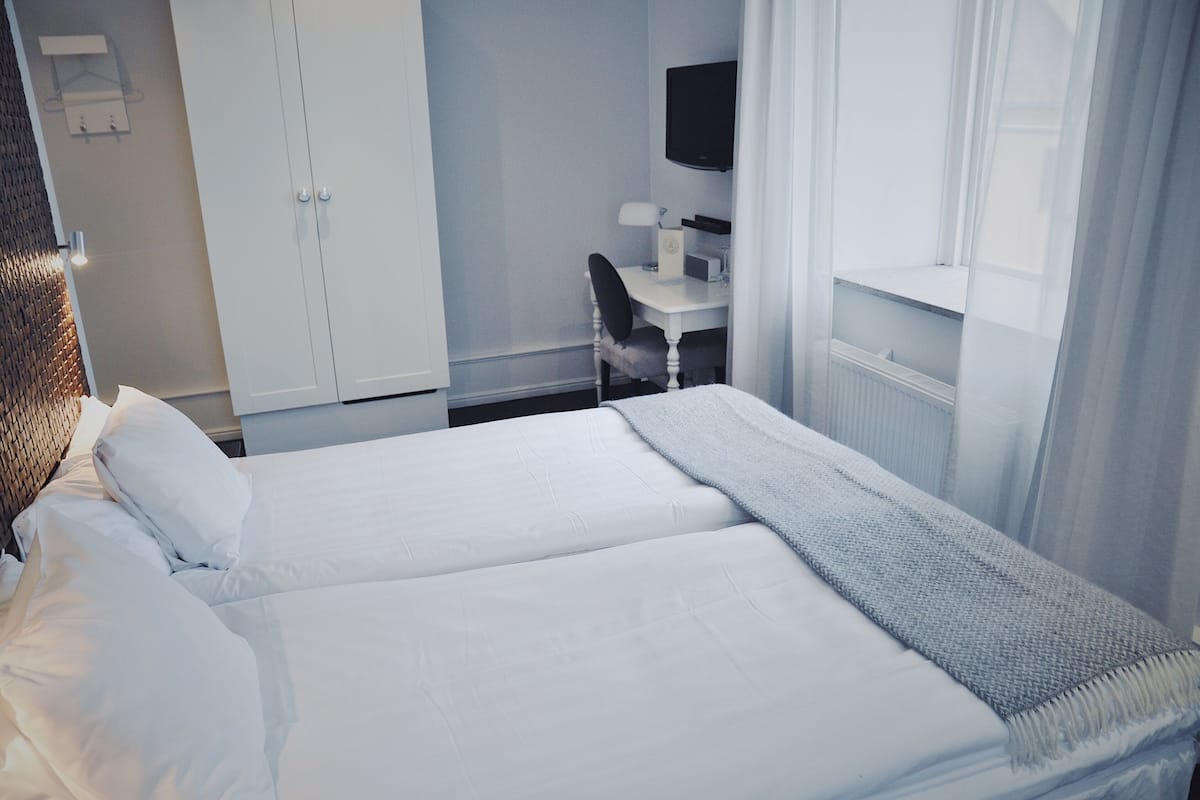Dubbelrum eller tvåbäddsrum (Superior Corner) | 1 sovrum, minibar och värdeförvaringsskåp på rummet
