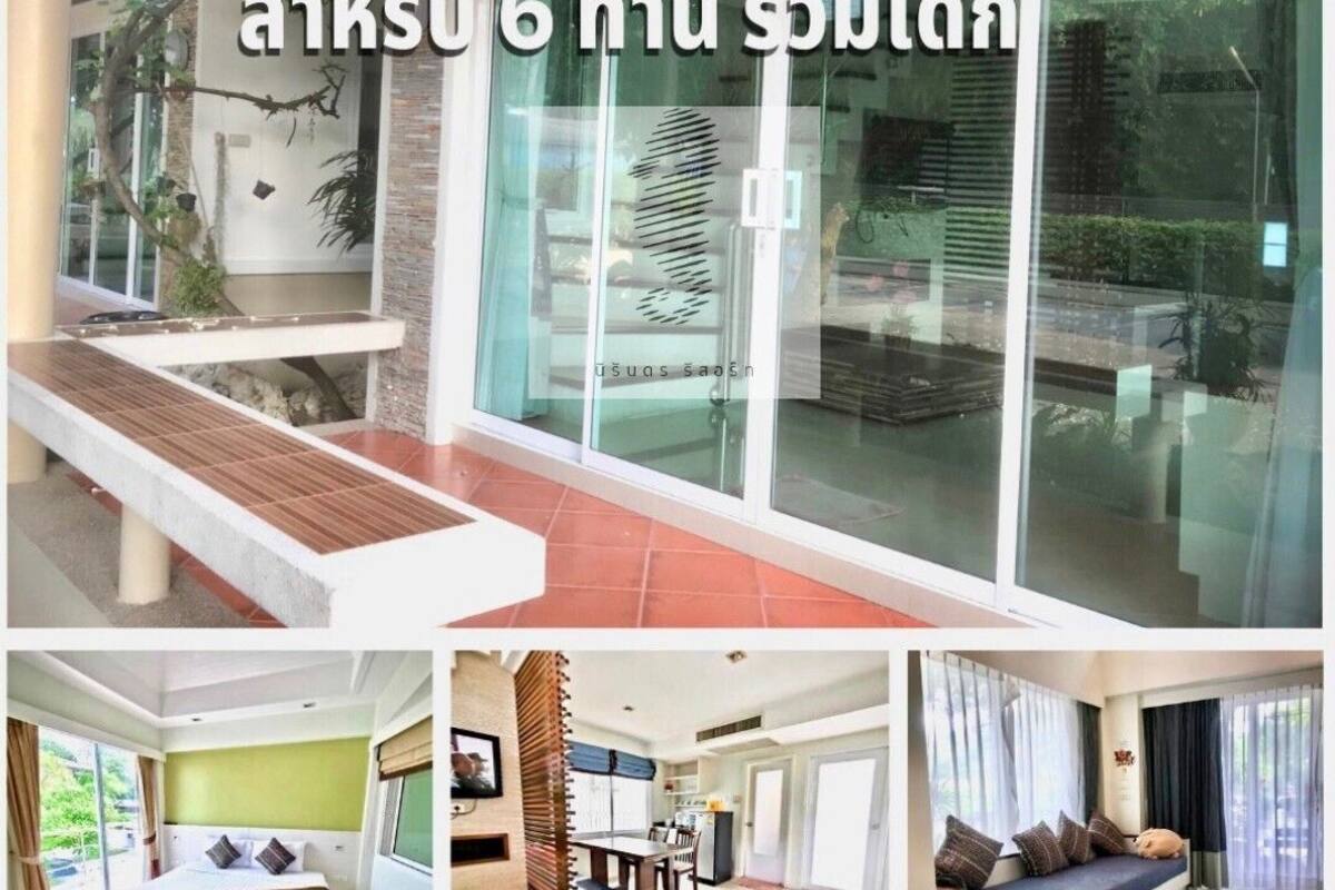A villa suite with a bedroom, a dining area, and a living area.
