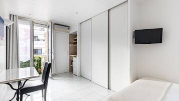 Premium bedding, blackout curtains, soundproofing, iron/ironing board