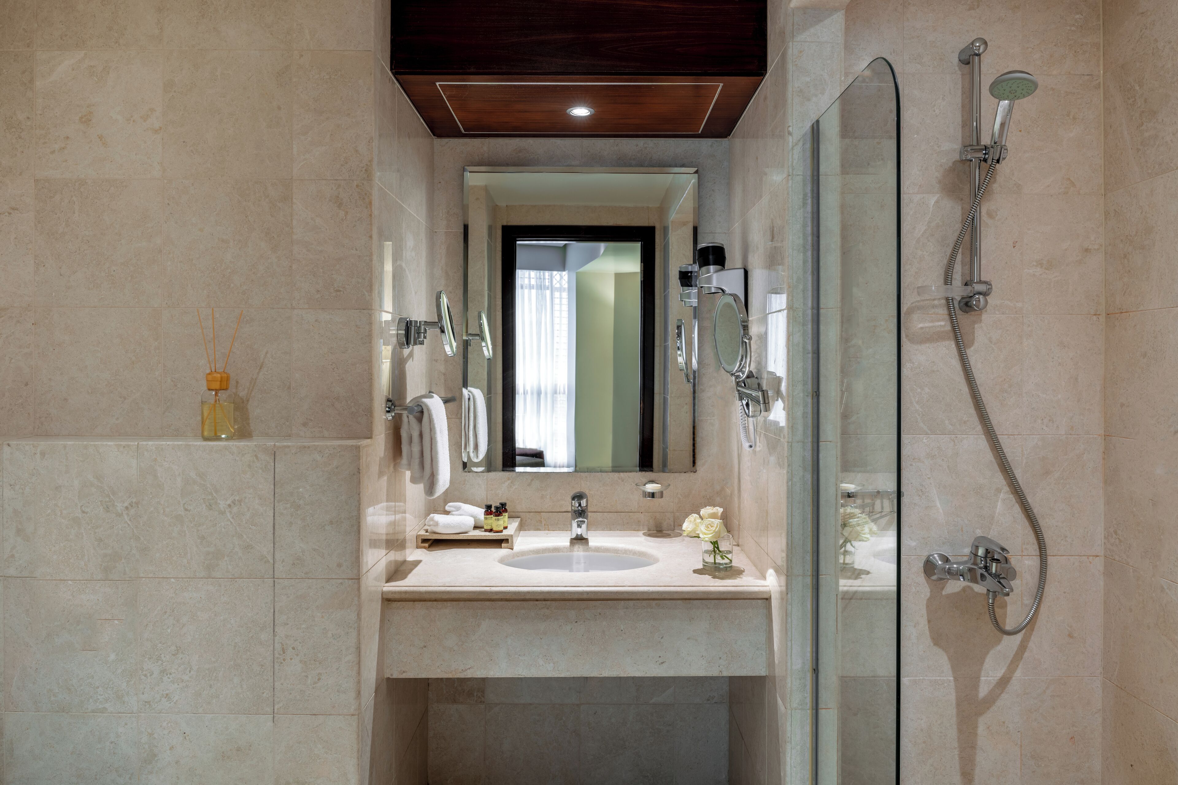 rainfall showerhead, designer toiletries, hair dryer, slippers