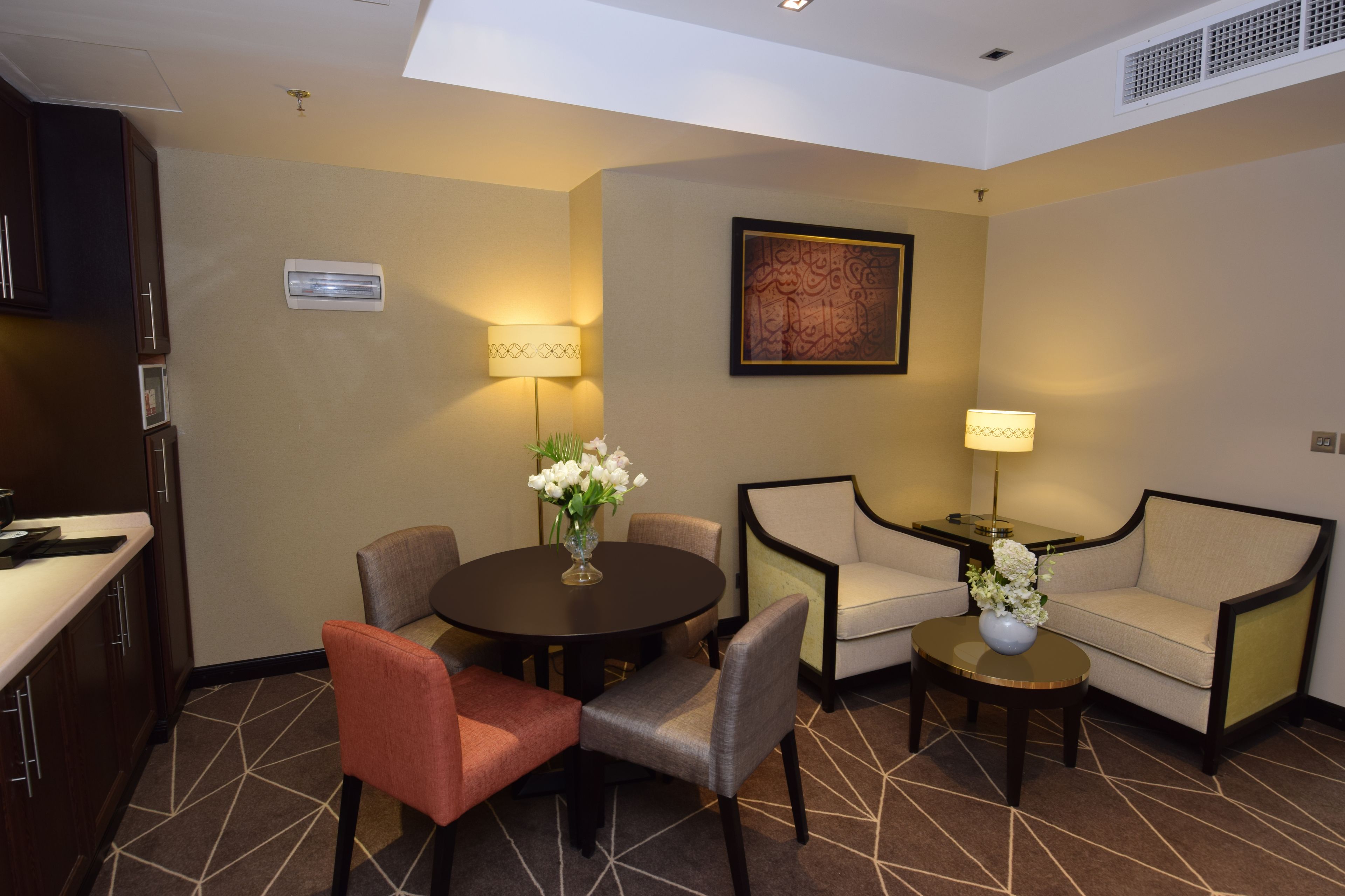 executive suite, city view (1 double bed and 2 twin beds) | living room | led tv