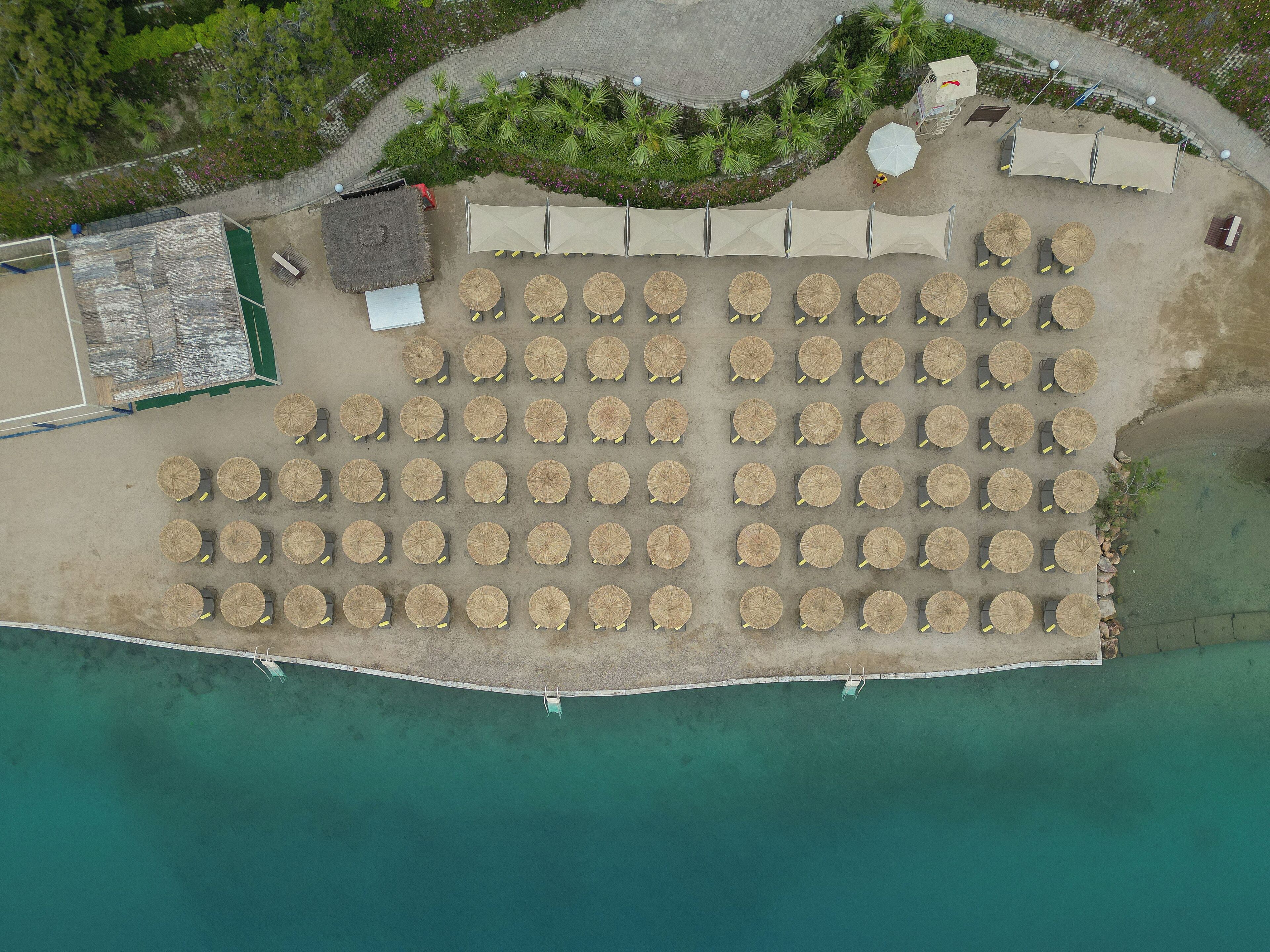 On the beach, sun loungers, beach umbrellas, beach bar