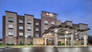 A Best Western Plus hotel with a modern design, featuring a covered entrance and multiple floors. - Best Western Plus Atrium Inn & Suites (Clarksville)