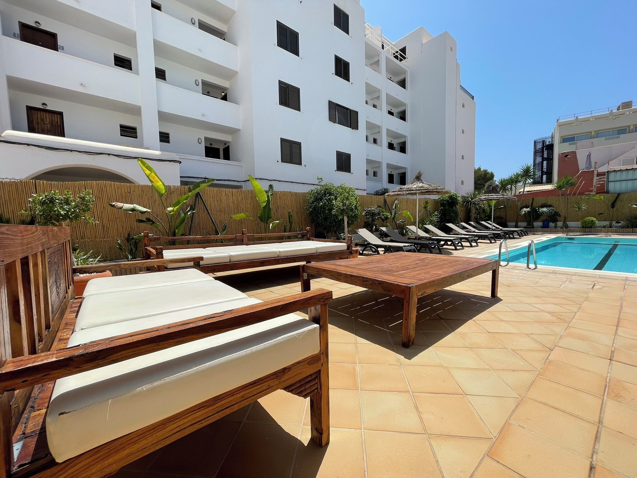 outdoor pool, pool umbrellas, pool loungers