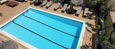 Outdoor pool, pool umbrellas, pool loungers